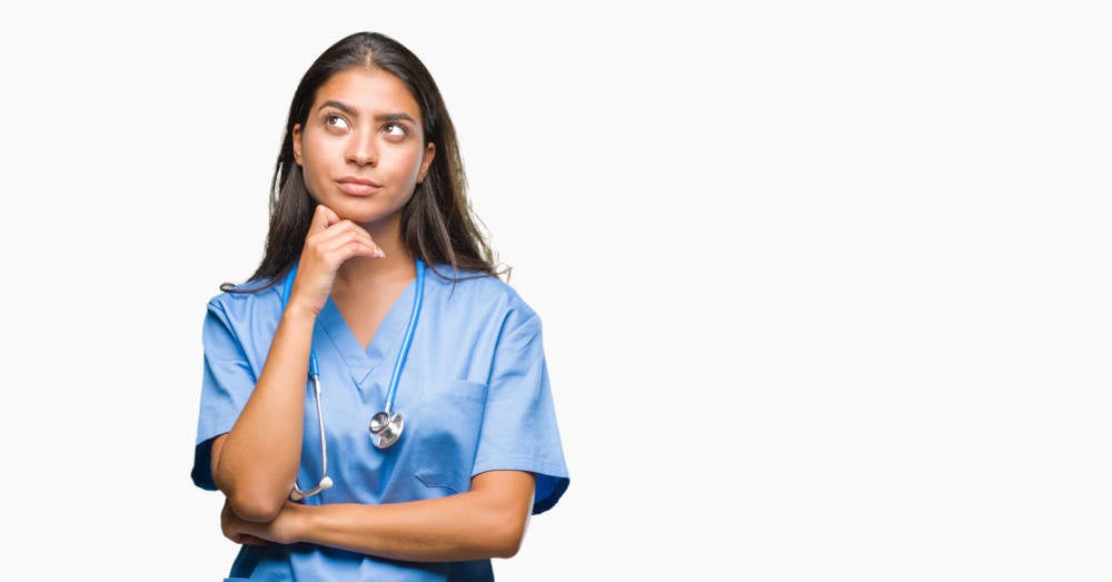 A woman daydreaming about becoming a nurse
