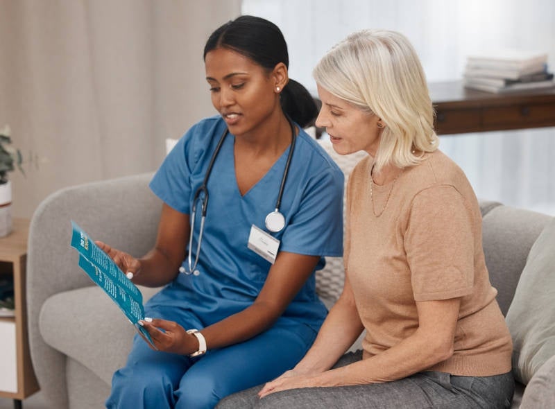 A nurse giving instructions to a patient based on their findings