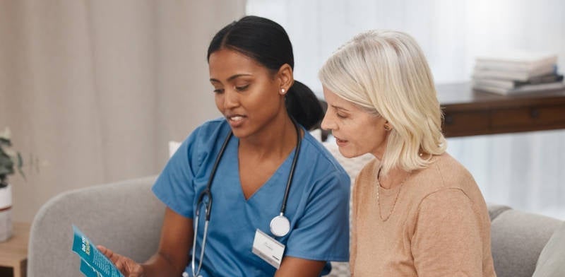 A nurse giving instructions to a patient based on their findings