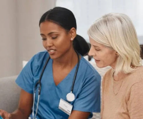 A nurse giving instructions to a patient based on their findings