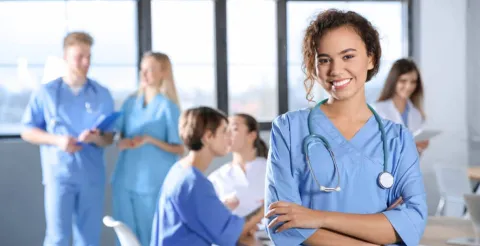 A happy nursing BSN student looking at the camera